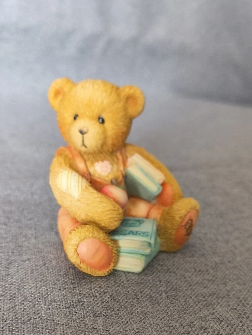 Cherished Teddies tan bear figurine with pastel blue and pink accents